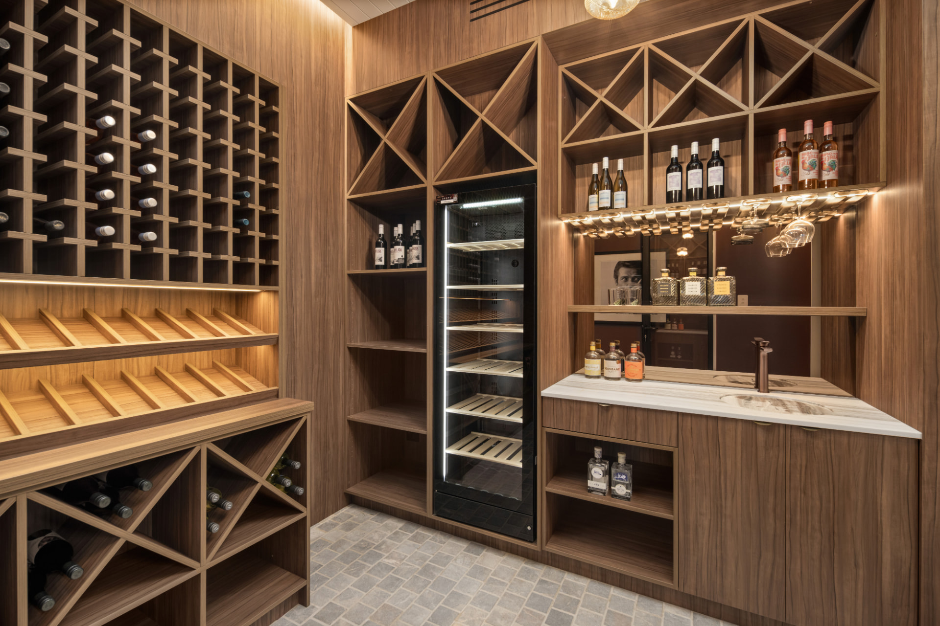 Walnut wine cellar with bar, sink and temperature-controlled cabinet
