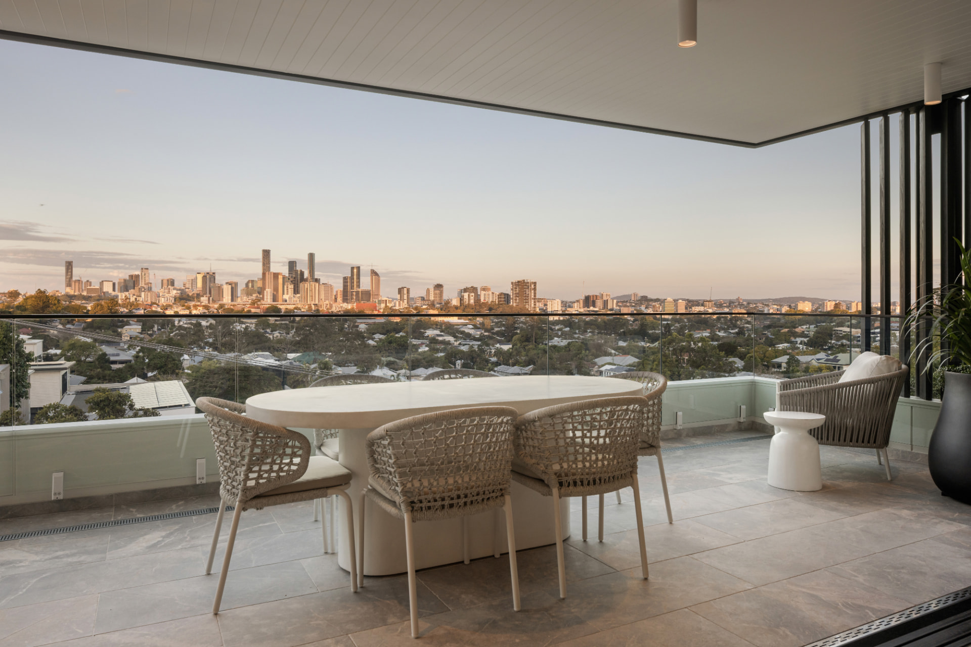 Covered terrace dining with Brisbane skyline views